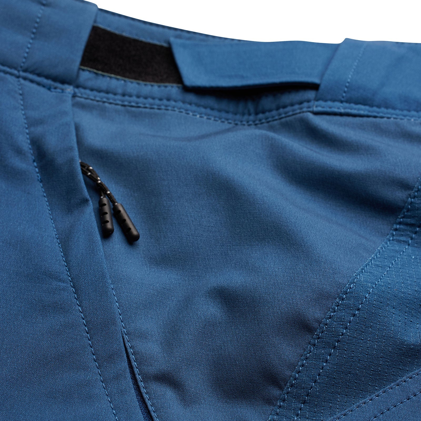 Close-up detail of blue Troy Lee Designs Skyline shorts showing fabric texture and construction