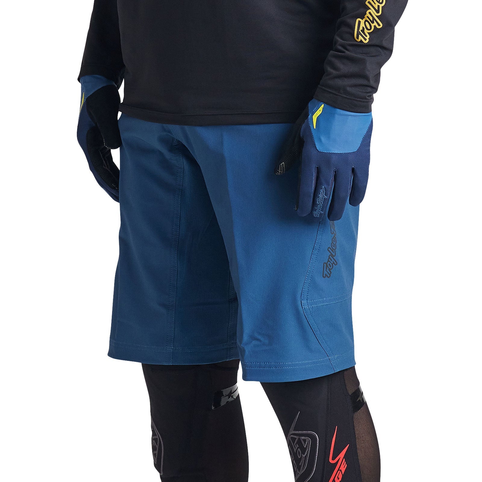 Troy Lee Designs Skyline shorts in blue with matching gloves on model