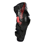 Troy Lee Designs black knee shin guards with red logo branding