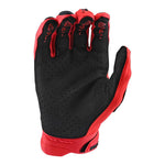Troy Lee Designs SE Pro Glove in red showing palm side with black grip pattern