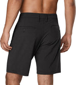 Back view of man wearing black Dakine Tofino hybrid shorts