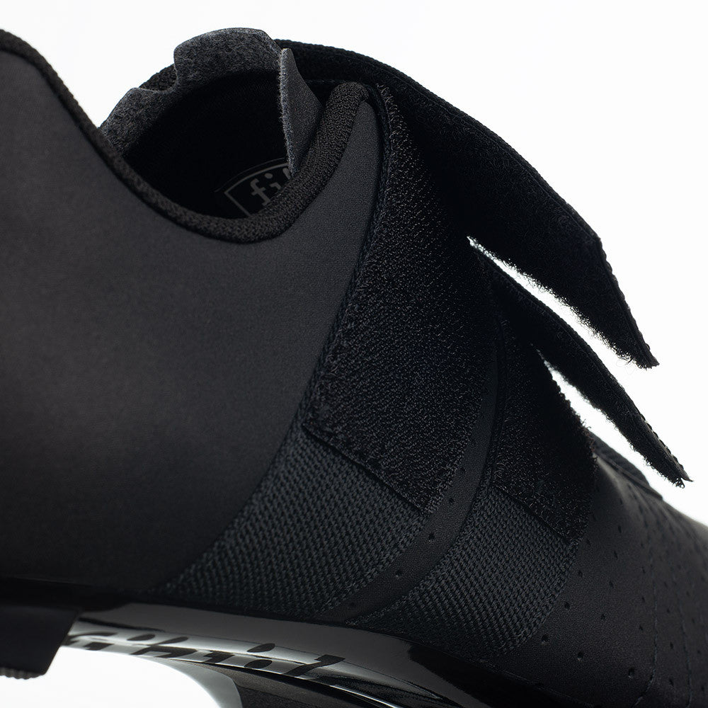 Close-up of Fizik Tempo R5 PowerStrap cycling shoe showing black upper and Velcro strap detail