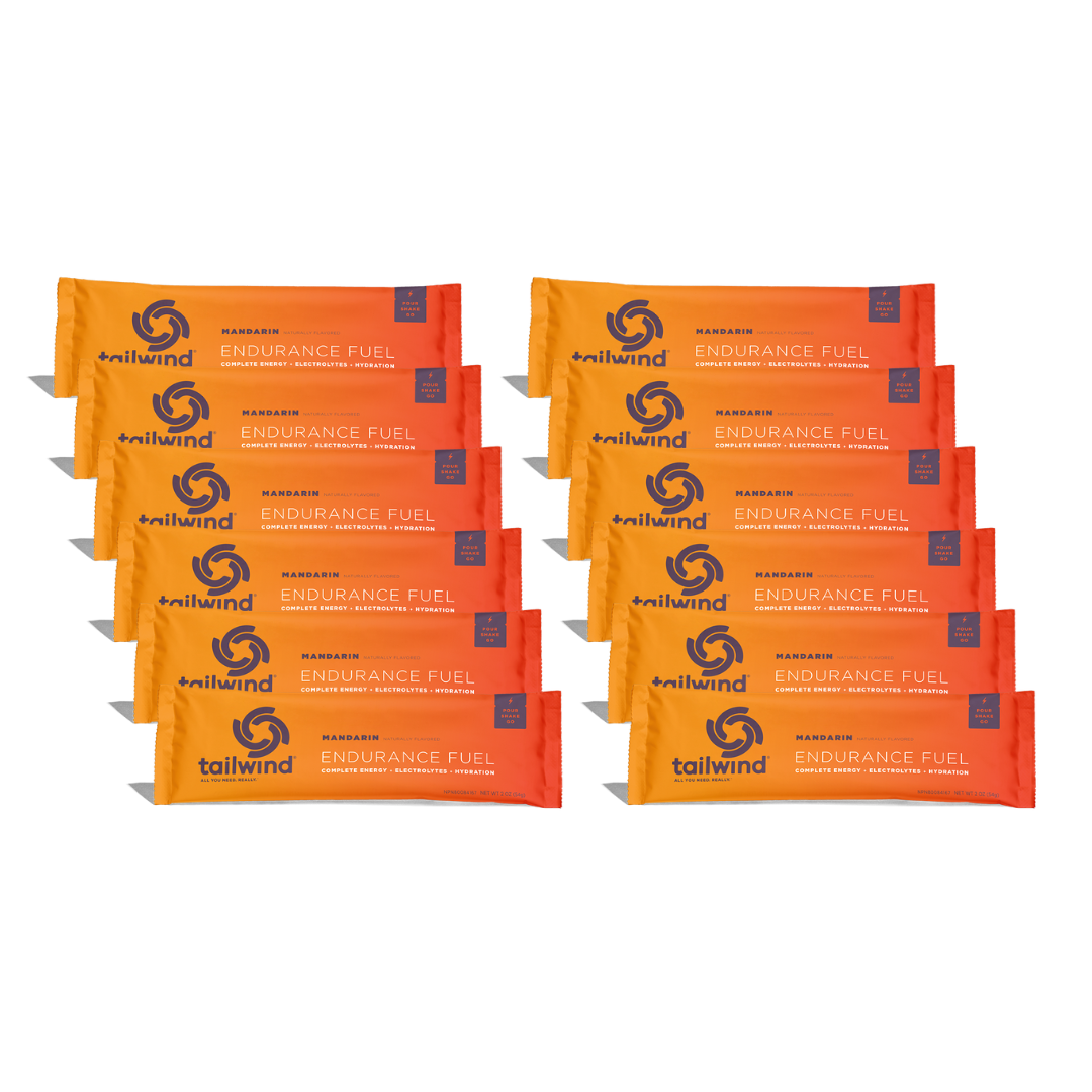 Tailwind Endurance Fuel Mandarin single-serve packets arranged in two stacks of six packets each