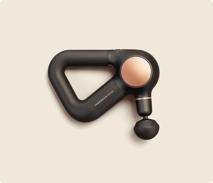 Therabody Theragun Sense percussion massage device in black with rose gold accents