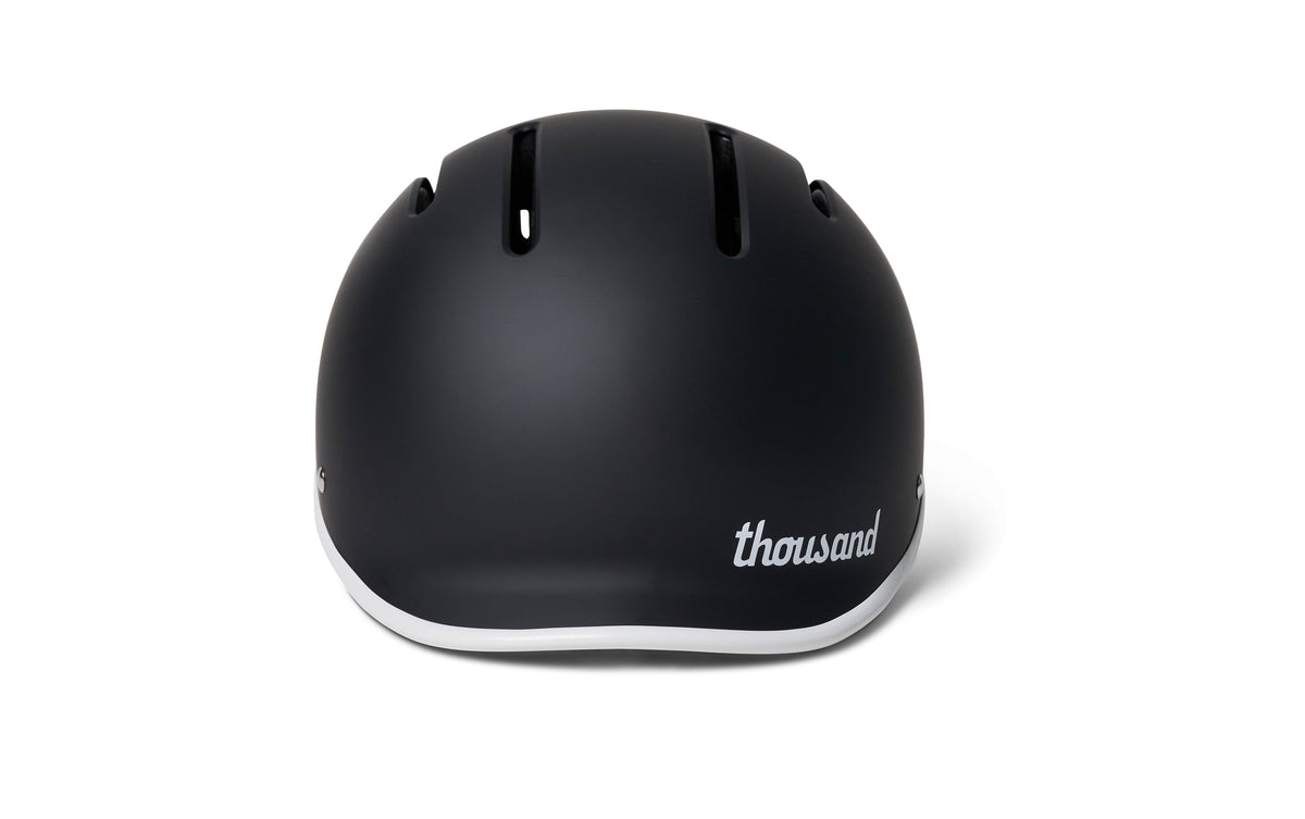 Thousand JR Kids Helmet in matte carbon black with white trim, rear view