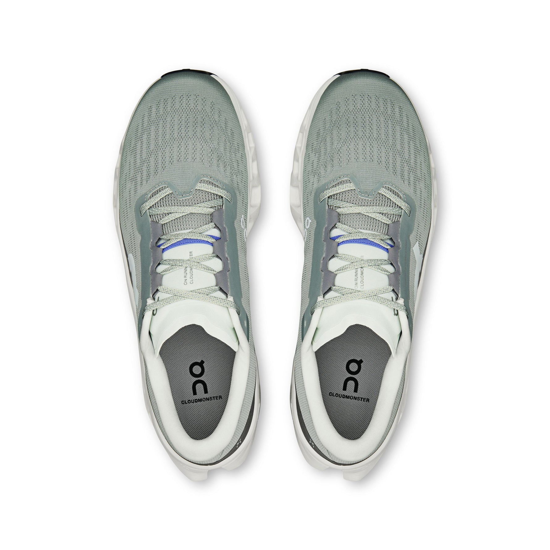On Cloudmonster 3 running shoes in sage green and ivory, top view showing both shoes