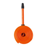 Tubolito Road 700c bicycle inner tube in bright orange coiled with Presta valve