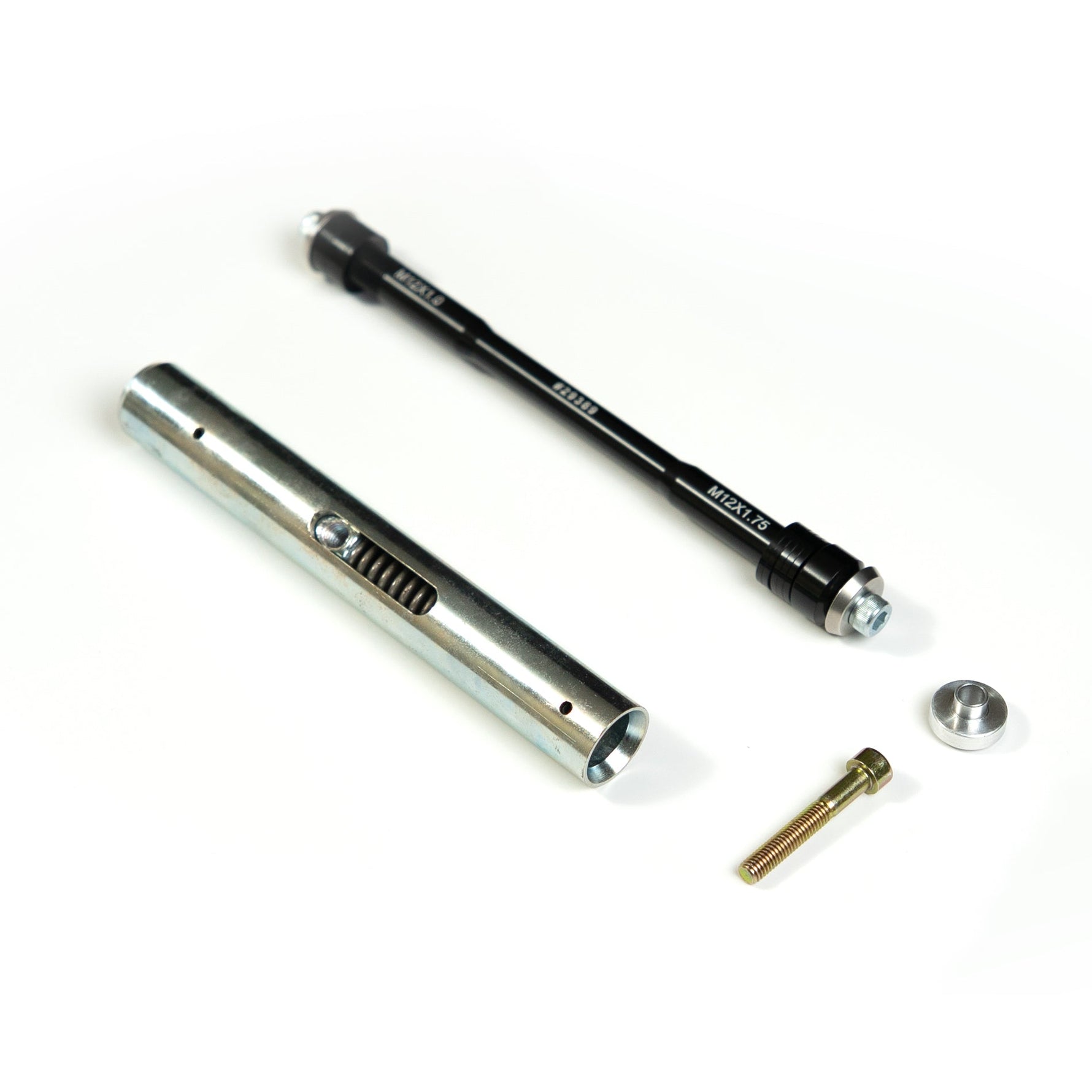 Saris thru axle adapter components on white background showing silver and black parts