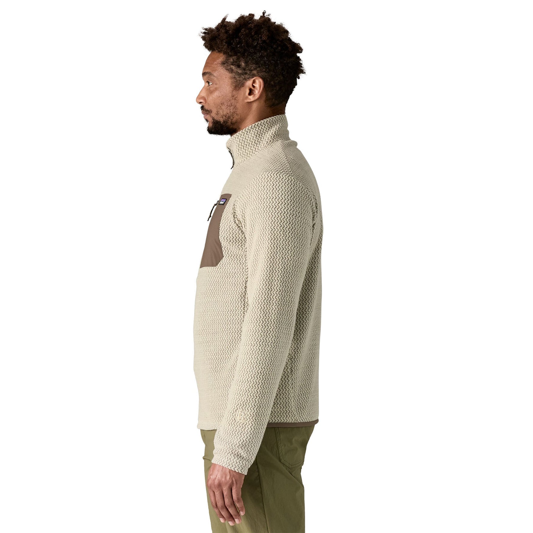 Man wearing Patagonia R1 Air fleece zip-neck in pelican color with brown accent panel