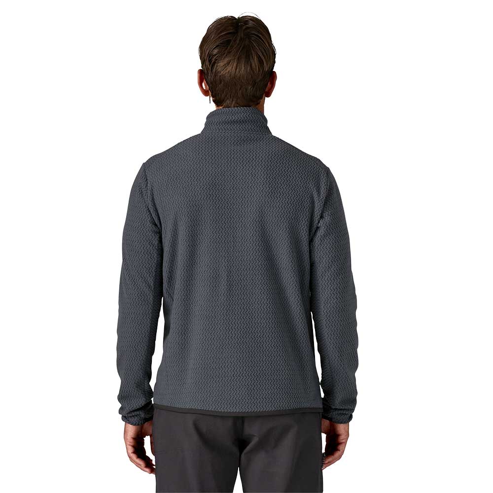 Back view of man wearing Patagonia R1 Air Zip-Neck in dark gray