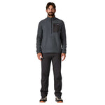 Man wearing Patagonia R1 Air Zip-Neck fleece in smolder blue with black pants