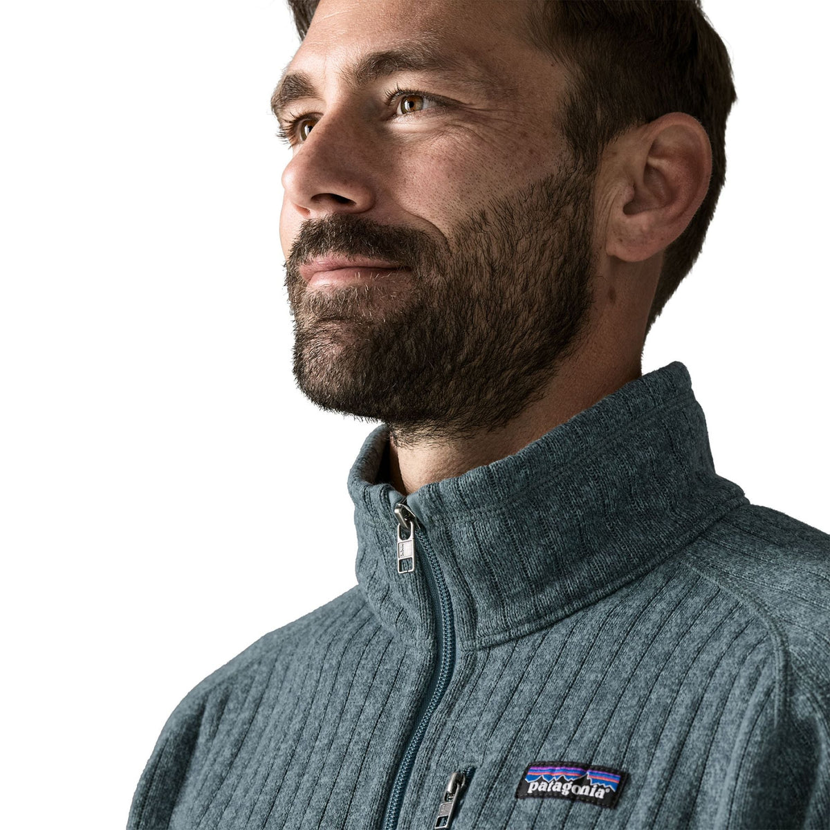 Close-up of man wearing Patagonia Better Sweater Fleece Jacket in Blue Sage rib knit, collar detail