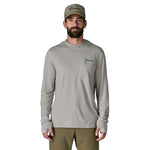 Man wearing Patagonia light grey hooded long-sleeve shirt with chest pocket