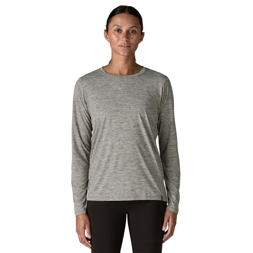 Woman wearing Patagonia long-sleeved Capilene Cool Daily shirt in feather grey heather, front view