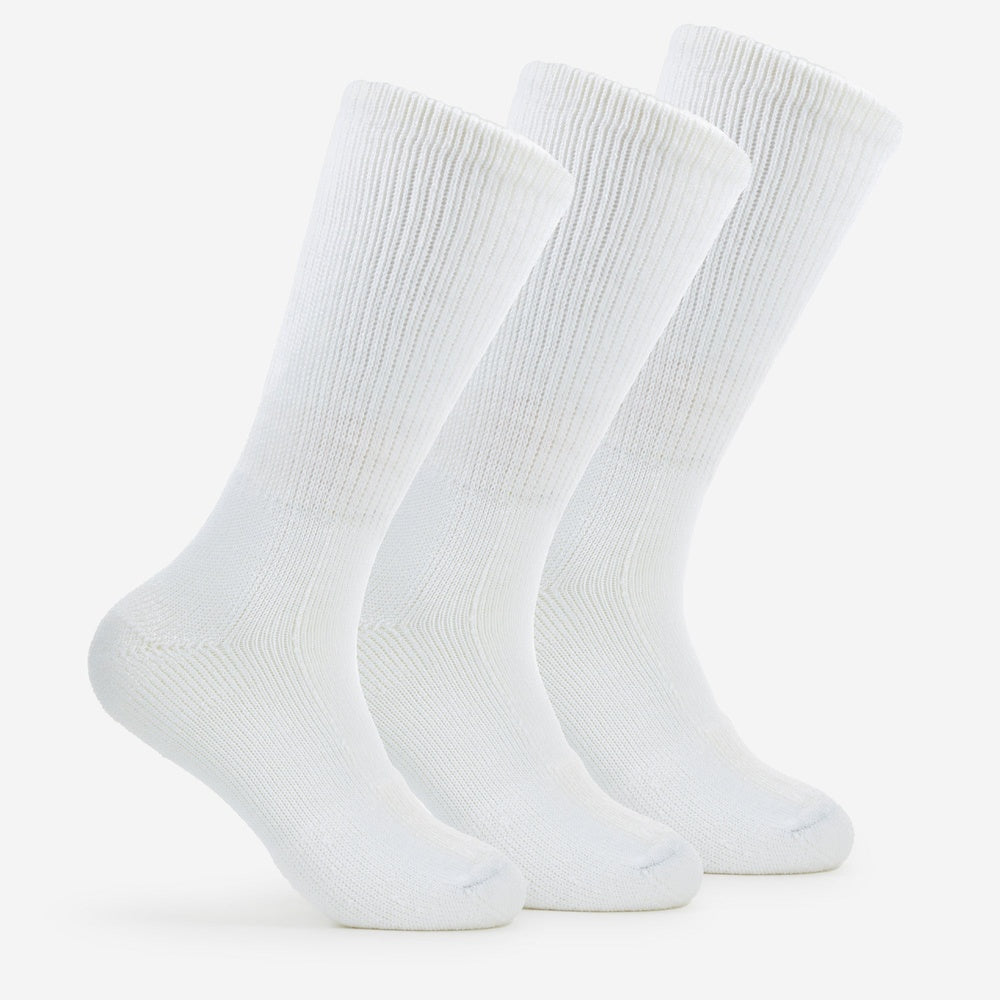 Three white Thorlos Walking Moderate Cushion Crew Socks displayed upright on clean background