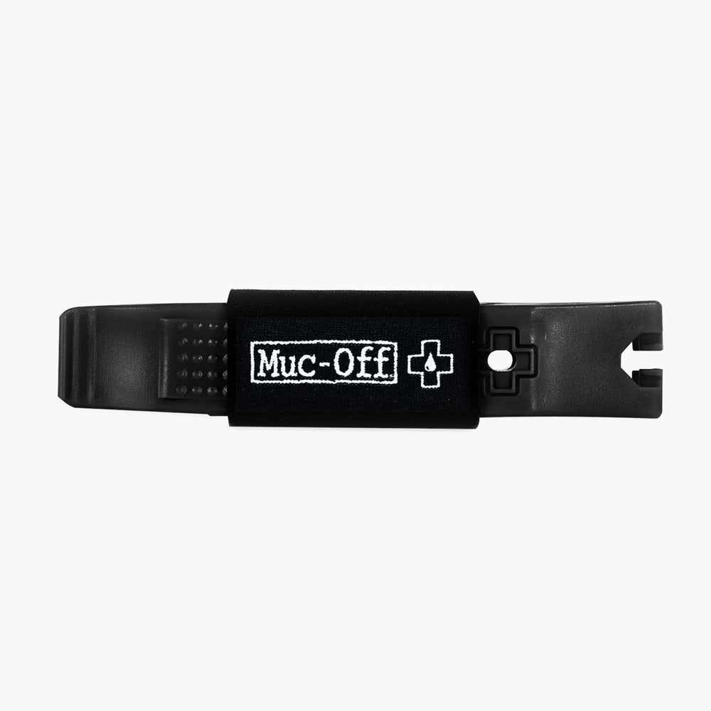 Muc-Off black tire lever with brand logo and white arrow indicator
