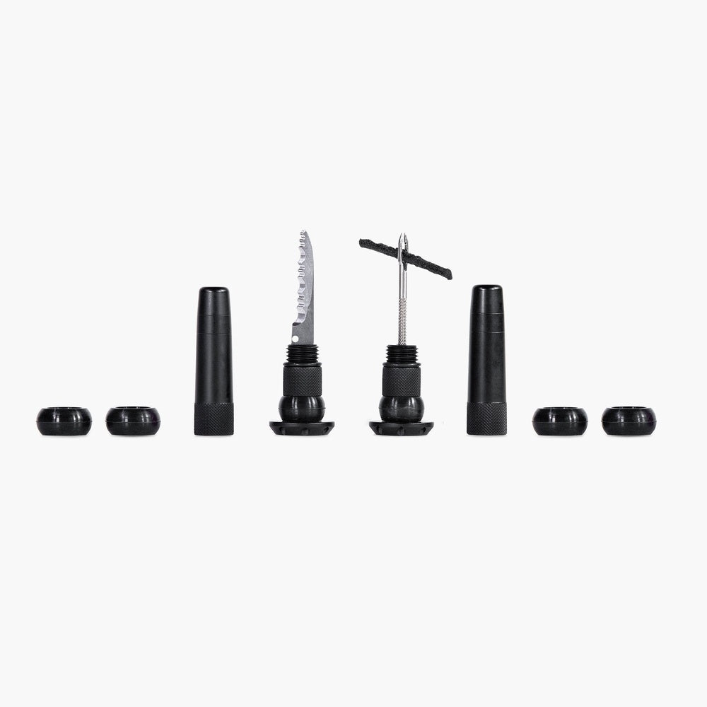 Muc-Off Stealth Tubeless Puncture Plugs kit with black components on white background