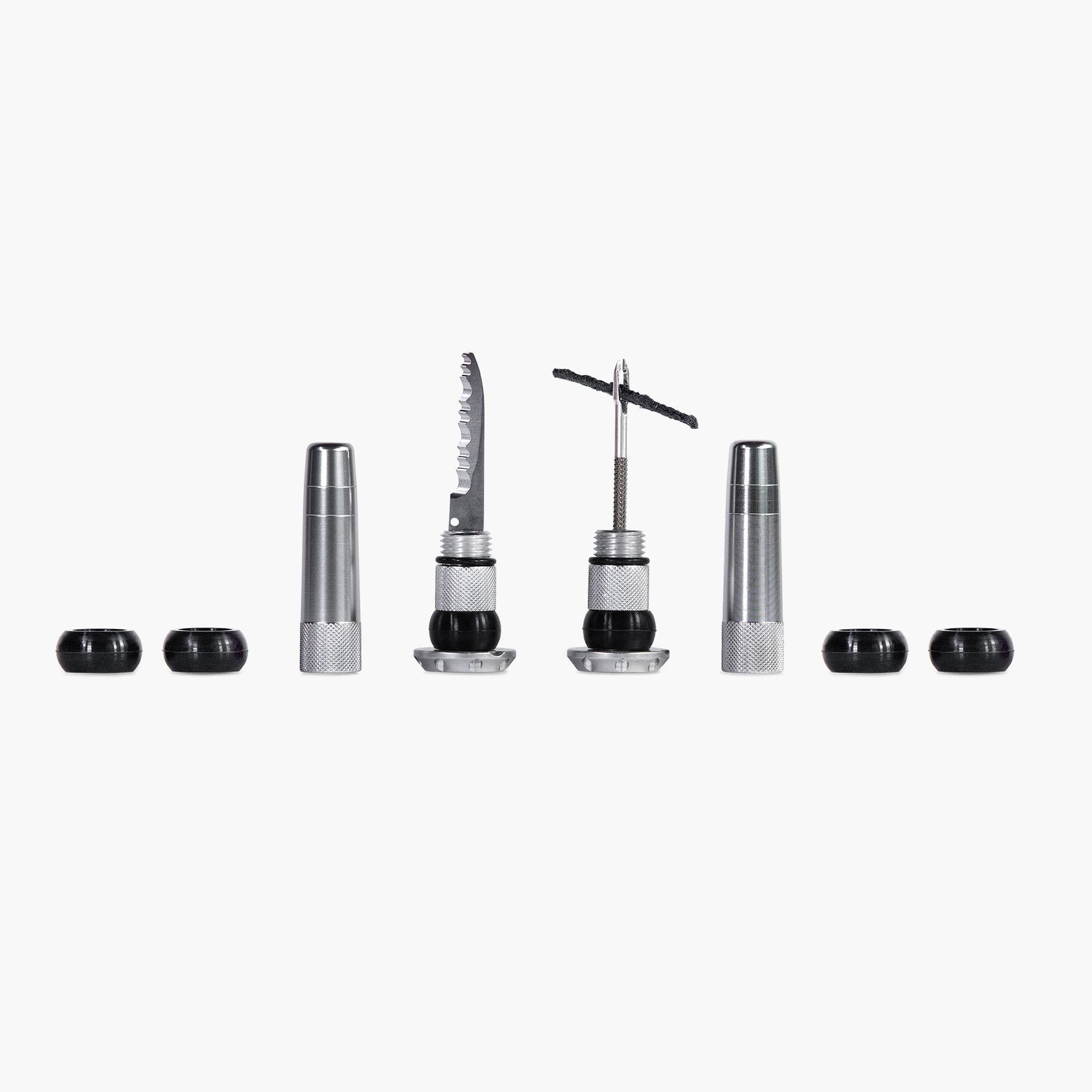 Muc-Off Stealth tubeless puncture plug kit with tools and plugs on white background