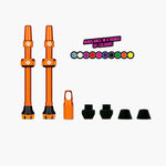 Orange Muc-Off tubeless valve kit with valve stems and accessories on white background