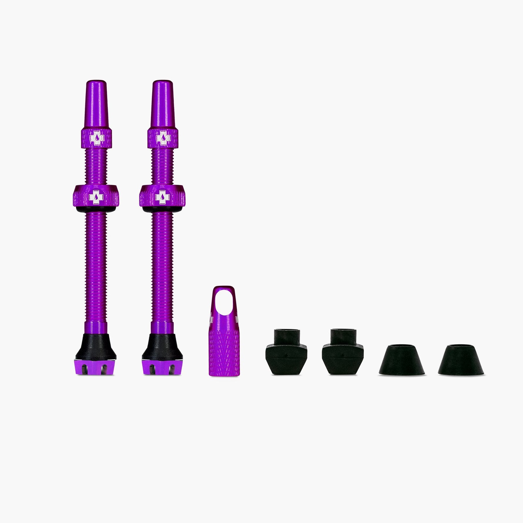 Muc-Off V2 Tubeless Valve Kit in iridescent purple with valve stems and accessories