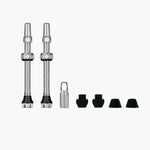 Muc-Off tubeless valve kit with two valves and accessories on white background