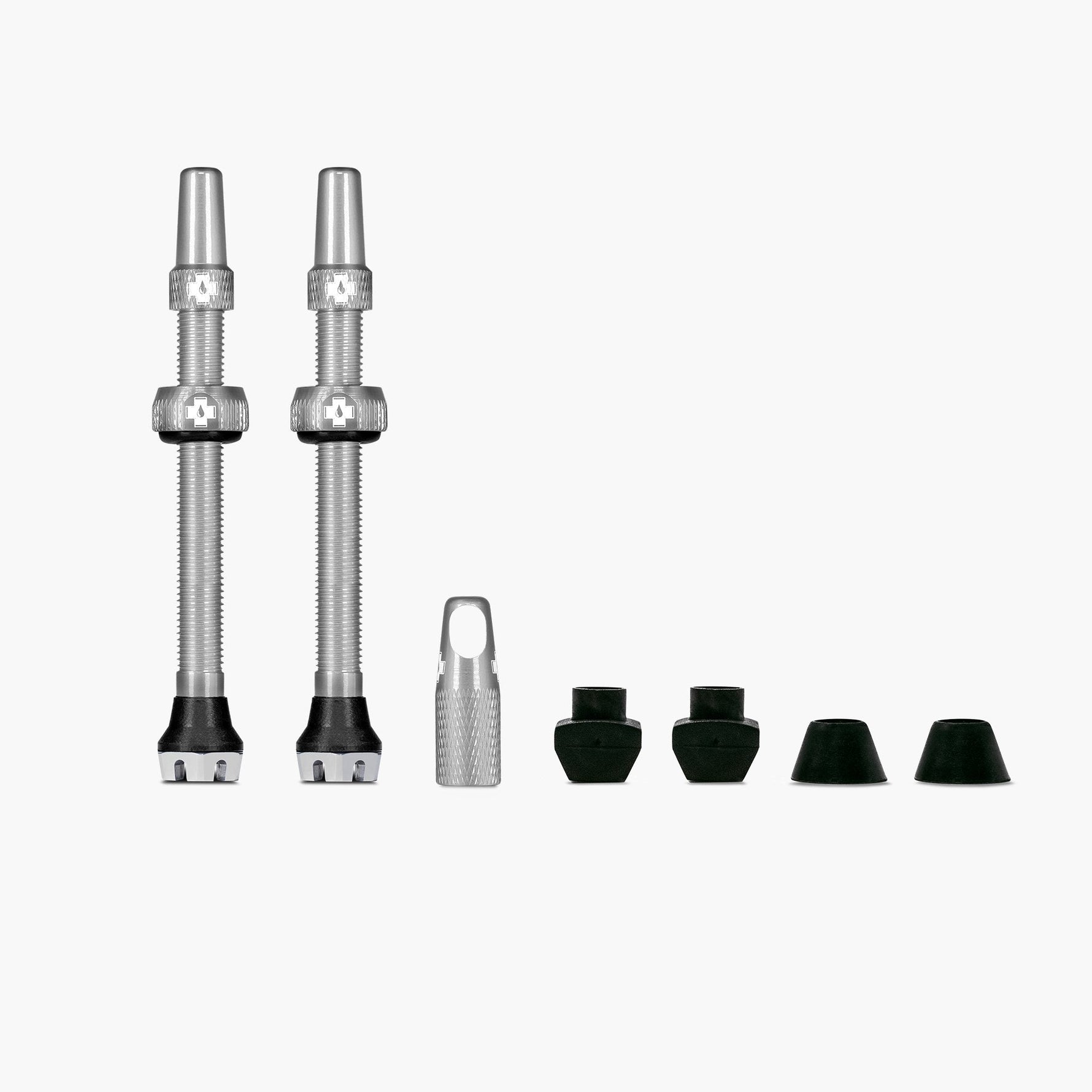 Muc-Off V2 tubeless valve kit with green caps and valve components