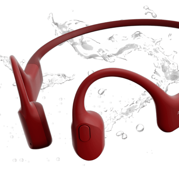 Red bone conduction headphones with water splash background showing waterproof design