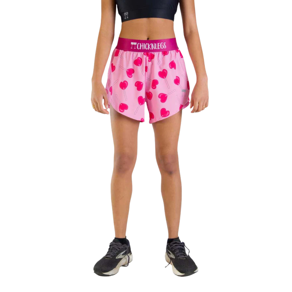 ChicknLegs women's pink athletic shorts with heart lollipop pattern and split hem design