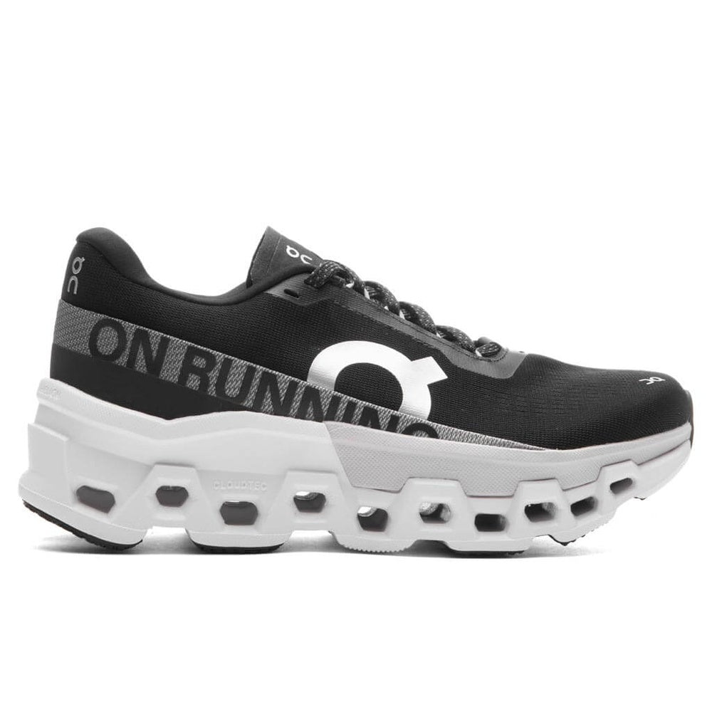 On Cloudmonster 2 running shoe in black with white sole and brand lettering