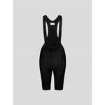 Black cycling bib shorts with mesh straps and padding on gray background