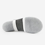 Bottom view of Thorlos Experia Energy Sock in gray with black and white stripe detail