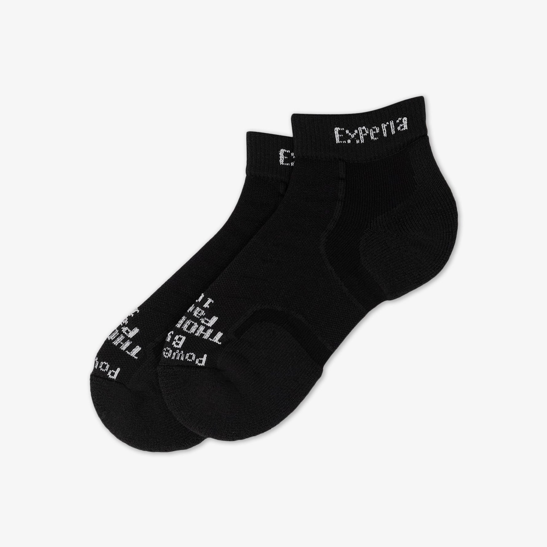 Pair of black Experia TECHFIT Light Cushion ankle socks on white background