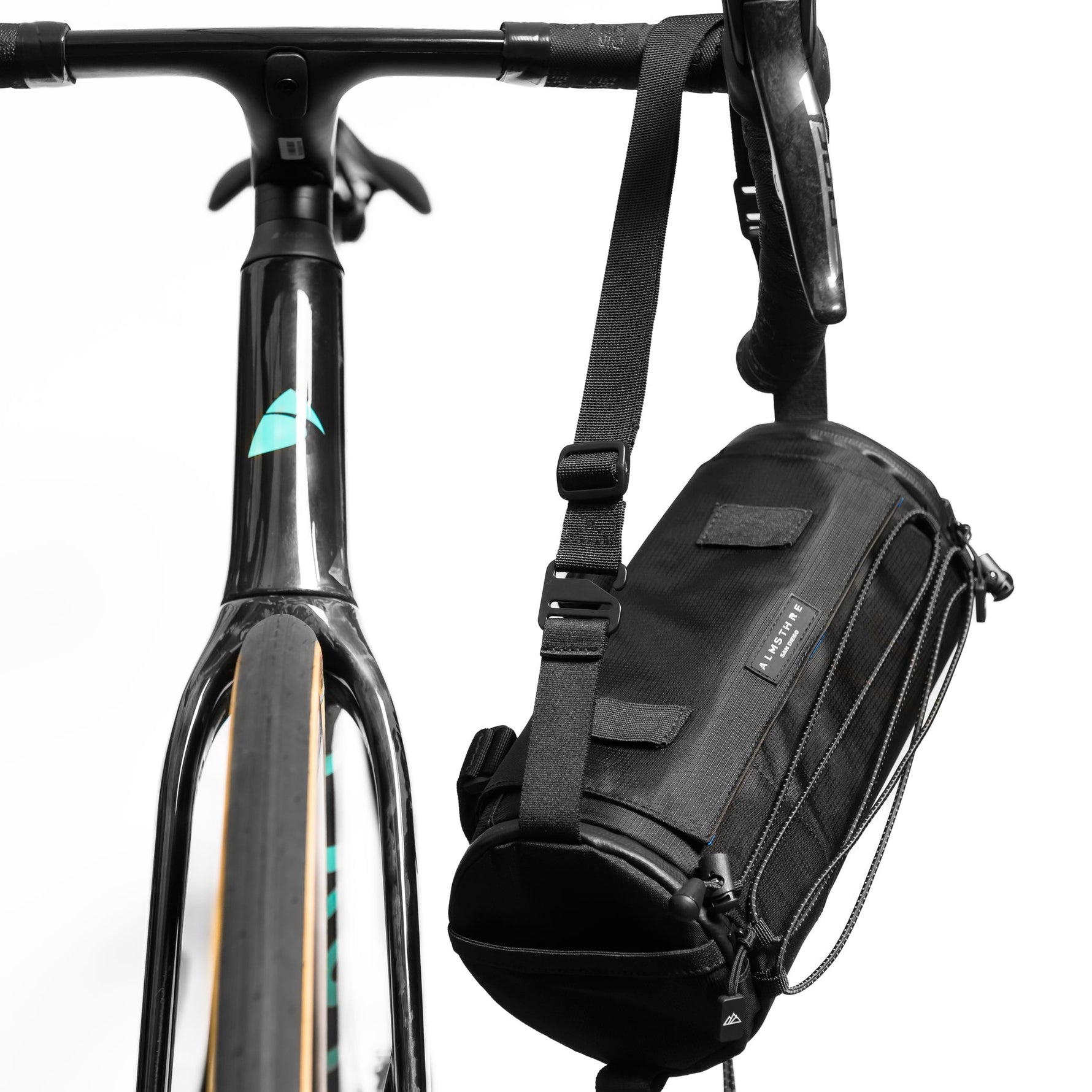 Black bike handlebar bag attached to bicycle with adjustable straps