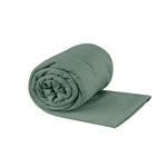 Sea To Summit Pocket Towel in sage green color, rolled and partially unfolded