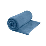 Sea To Summit Tek Towel in blue, partially rolled showing microfiber texture