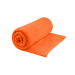 Orange Sea to Summit Tek Towel rolled and partially unfolded on white background