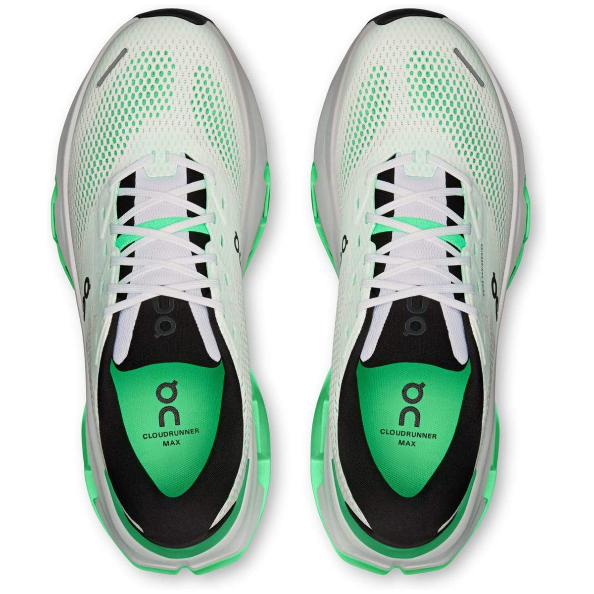 On Cloudrunner Max running shoes top-down view showing white mesh and verdite green insoles