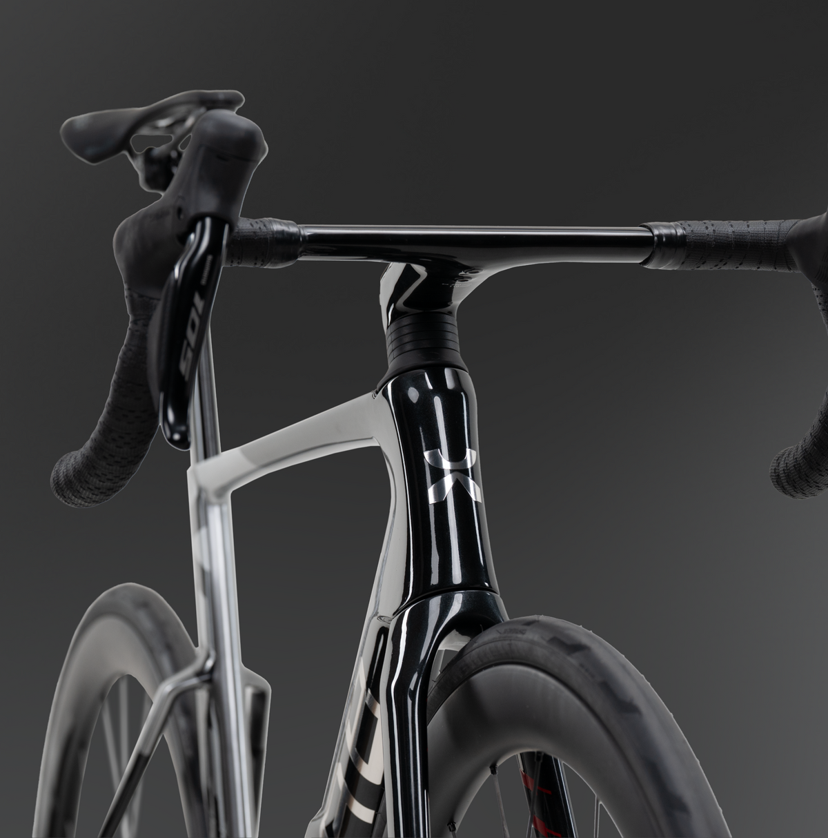 Close-up detail shot of X-LAB AD8 front fork, stem and handlebar in grey and black