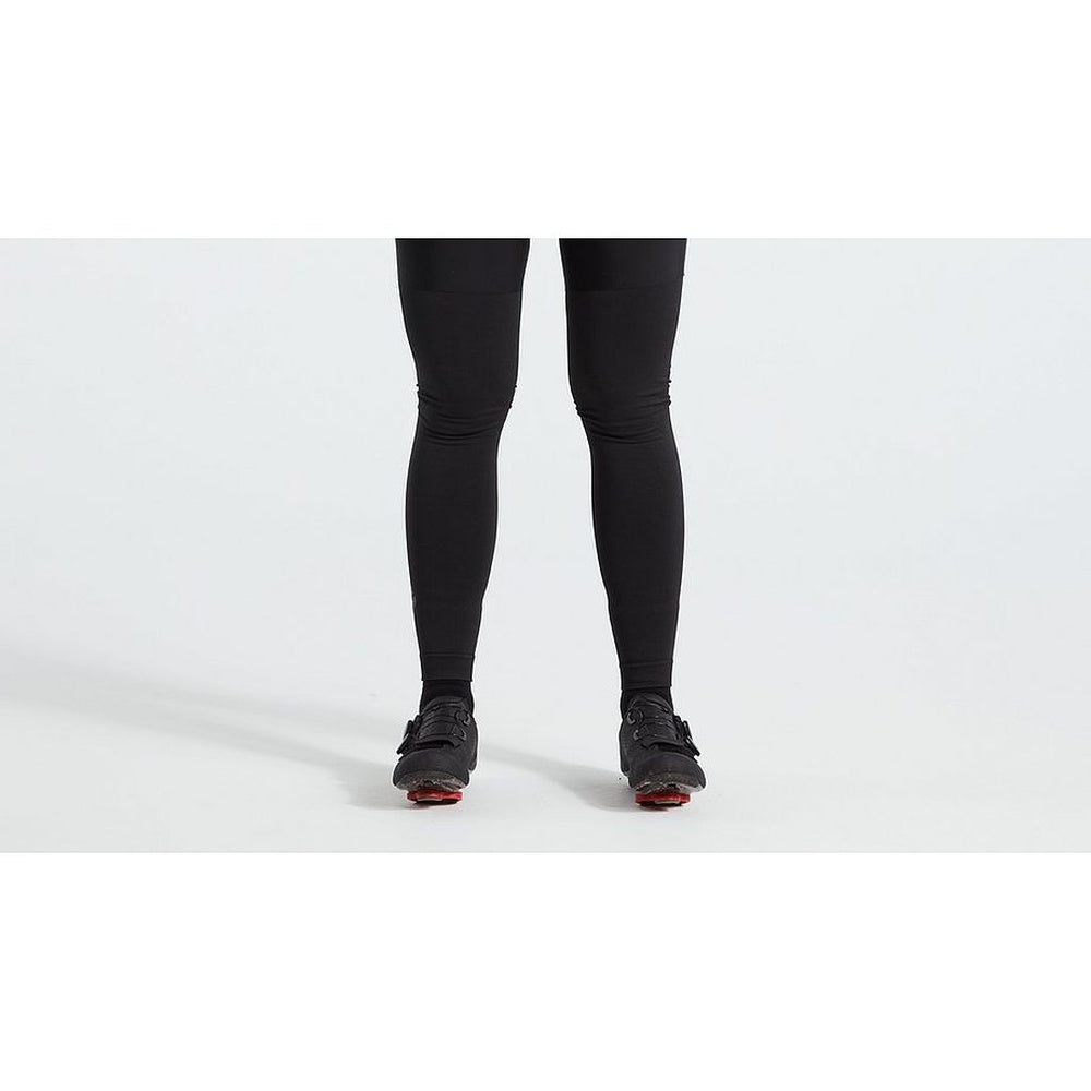 Specialized Seamless Leg Warmers in black shown on model with cycling shoes