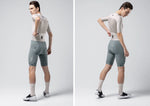 Gobik Brooklyn cycling suit in argonite colorway with white jersey and green shorts
