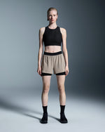 Woman wearing On 3 Performance 2/1 Shorts in cinder with black waistband