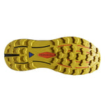 Yellow Brooks Cascadia 16 running shoe sole with black and red traction pattern