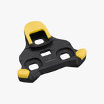 Single Shimano CL-SL110 SPD-SL yellow cleat angled view showing three-bolt mounting pattern