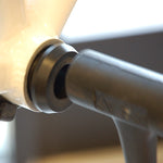 Close-up of black Wheels Manufacturing BB30 bottom bracket adapter with professional lighting