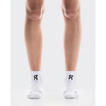 On Core Run Sock Mid 2P white socks worn on legs