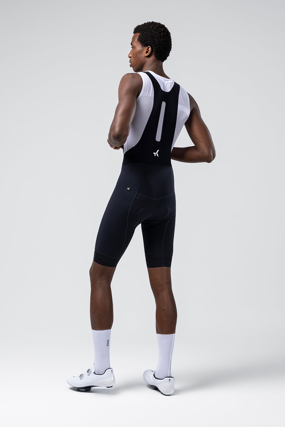 Gobik Absolute Compact 7.0 bib shorts in ultrablue, rear view on male model