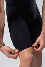 Close-up of black Gobik cycling bib shorts on model showing fit and fabric detail