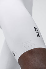 Gobik white cycling bib shorts with perforated ventilation panels and brown chamois interior