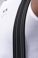 Close-up of white Gobik Lancer bib shorts with black side stripes and mesh fabric