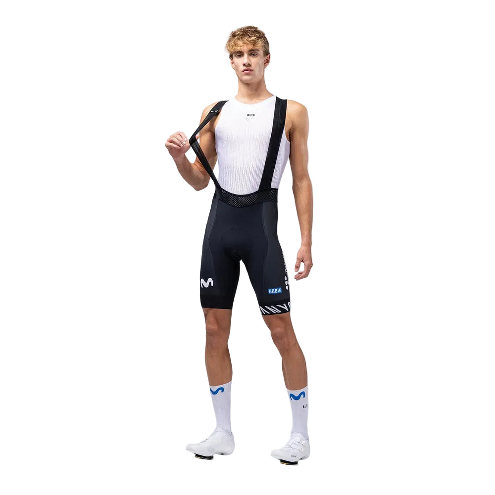 Male cyclist wearing navy blue Gobik Limited 6.0 bib shorts with Movistar team colors